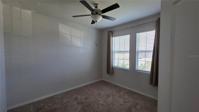 13111 Pepper Stem St, Spring Hill, FL 34609 - empty room with carpet flooring, baseboards, and a ceiling fan