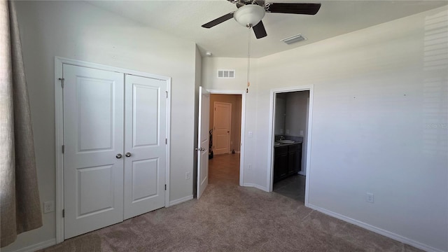 13111 Pepper Stem St, Spring Hill, FL 34609 - unfurnished bedroom with carpet flooring, a closet, baseboards, and a ceiling fan
