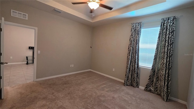 13111 Pepper Stem St, Spring Hill, FL 34609 - unfurnished room featuring a ceiling fan, carpet, baseboards, and a raised ceiling