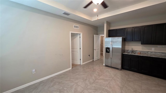13111 Pepper Stem St, Spring Hill, FL 34609 - kitchen featuring stainless steel fridge with ice dispenser, a ceiling fan, dark cabinets, and a sink