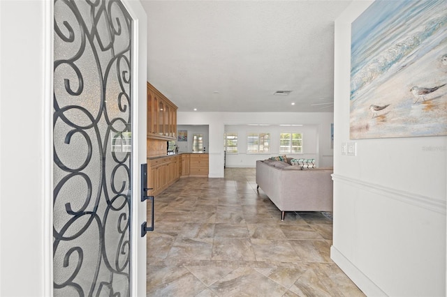 629 Fort Duquesna Dr, Sun City Center, FL 33573 - hallway featuring stone finish floors