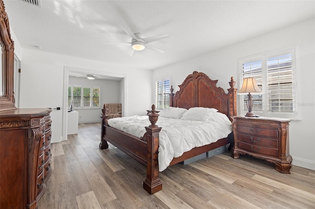 629 Fort Duquesna Dr, Sun City Center, FL 33573 - bedroom with light wood-type flooring, ceiling fan, and baseboards