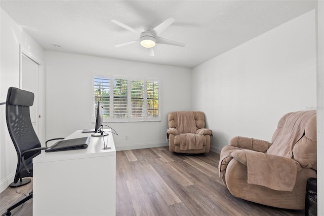 629 Fort Duquesna Dr, Sun City Center, FL 33573 - home office featuring wood finished floors, ceiling fan, and baseboards