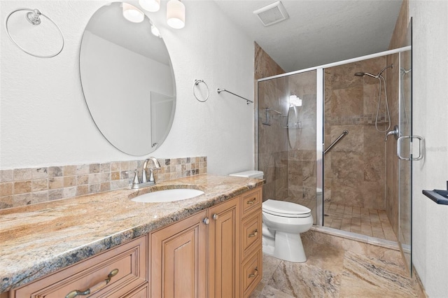 629 Fort Duquesna Dr, Sun City Center, FL 33573 - bathroom with vanity, toilet, a stall shower, and decorative backsplash