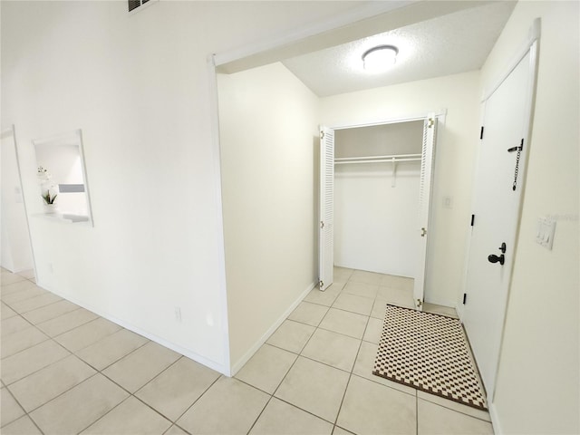 2935 Lichen Ln Unit D, Clearwater, FL 33760 - laundry area with light tile patterned floors