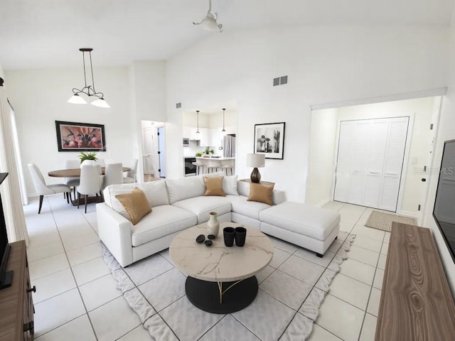 2935 Lichen Ln Unit D, Clearwater, FL 33760 - living room with light tile patterned flooring and high vaulted ceiling