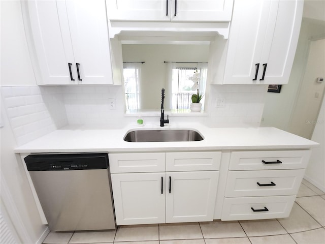 2935 Lichen Ln Unit D, Clearwater, FL 33760 - kitchen with stainless steel dishwasher, white cabinets, and backsplash