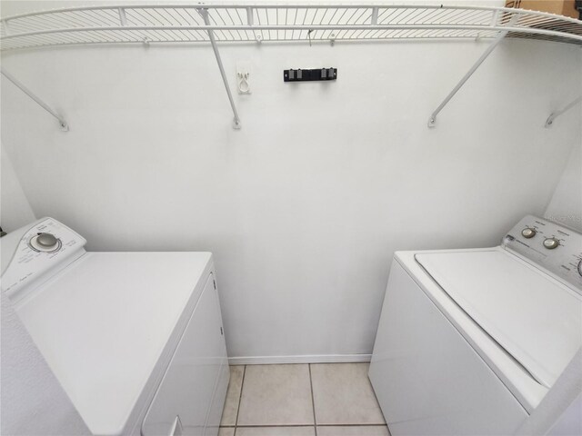 2935 Lichen Ln Unit D, Clearwater, FL 33760 - laundry area featuring separate washer and dryer and light tile patterned floors