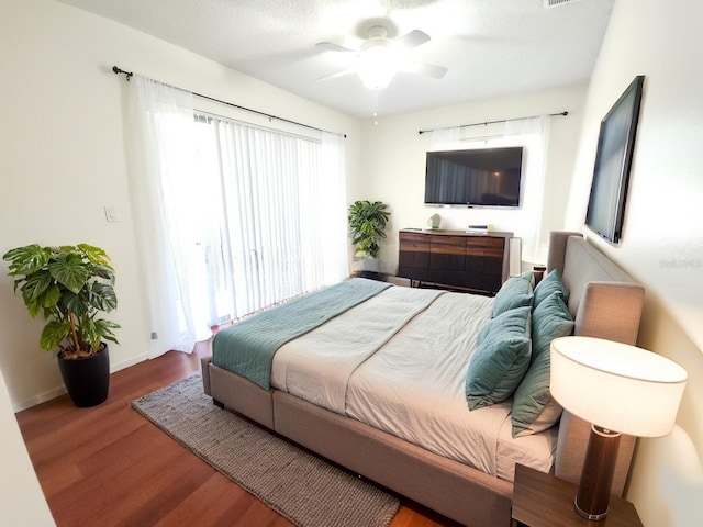 2935 Lichen Ln Unit D, Clearwater, FL 33760 - bedroom with wood finished floors and a ceiling fan