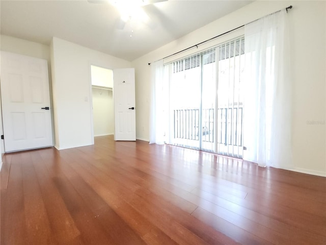 2935 Lichen Ln Unit D, Clearwater, FL 33760 - empty room with wood finished floors and ceiling fan