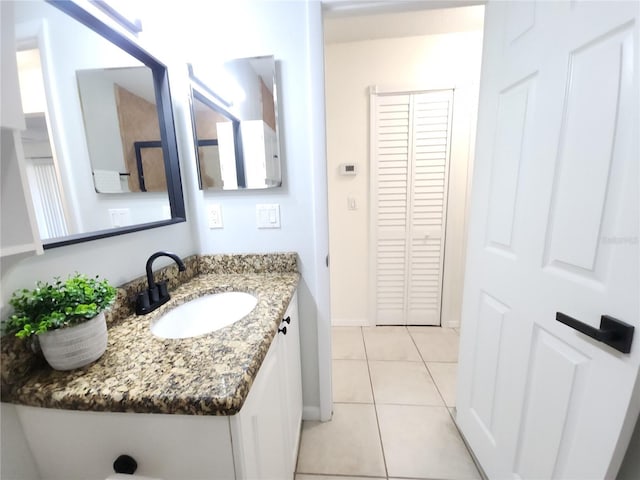 2935 Lichen Ln Unit D, Clearwater, FL 33760 - bathroom featuring tile patterned flooring, vanity, and a closet