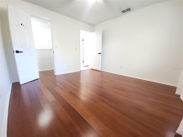 2935 Lichen Ln Unit D, Clearwater, FL 33760 - spare room featuring dark wood-style floors and baseboards