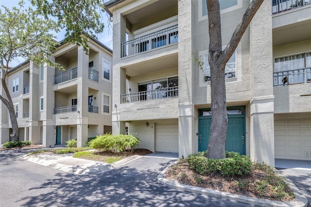 731 Cruise View Dr, Tampa, FL 33602 - view of apartment building / complex featuring a garage
