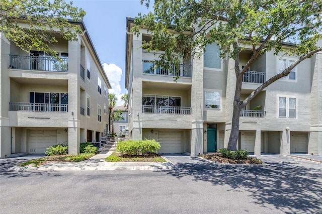 731 Cruise View Dr, Tampa, FL 33602 - view of apartment building / complex with an attached garage