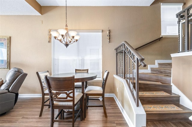 731 Cruise View Dr, Tampa, FL 33602 - dining room with a chandelier, stairway, wood finished floors, and baseboards