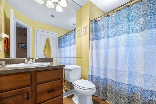 731 Cruise View Dr, Tampa, FL 33602 - full bath with toilet, vanity, and wood finished floors
