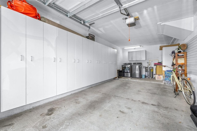 731 Cruise View Dr, Tampa, FL 33602 - garage featuring washer and dryer, a garage door opener, and water heater