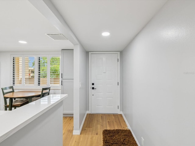 3062 Eastland Blvd Unit 405, Clearwater, FL 33761 - entrance foyer with light wood-style floors, baseboards, and recessed lighting
