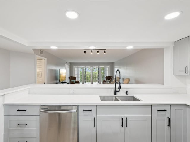 3062 Eastland Blvd Unit 405, Clearwater, FL 33761 - kitchen featuring stainless steel dishwasher, a sink, light countertops, recessed lighting, and a peninsula