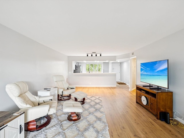 3062 Eastland Blvd Unit 405, Clearwater, FL 33761 - living room featuring light wood finished floors and baseboards