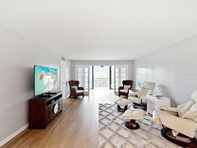 3062 Eastland Blvd Unit 405, Clearwater, FL 33761 - living area featuring light wood finished floors and baseboards