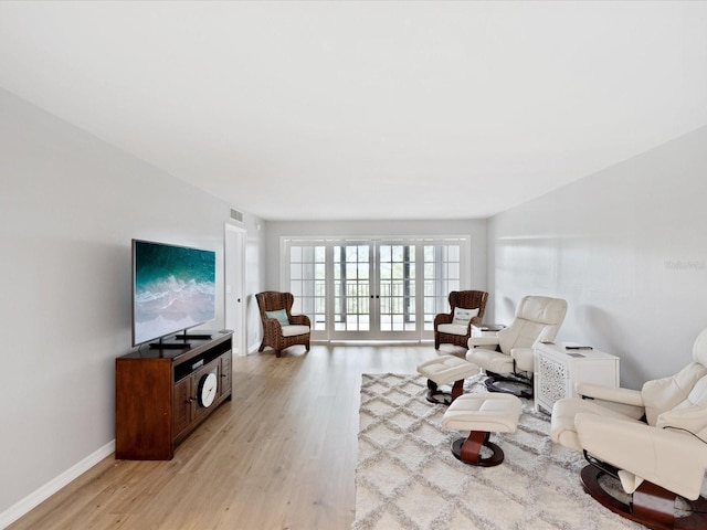3062 Eastland Blvd Unit 405, Clearwater, FL 33761 - living area featuring light wood-type flooring and baseboards