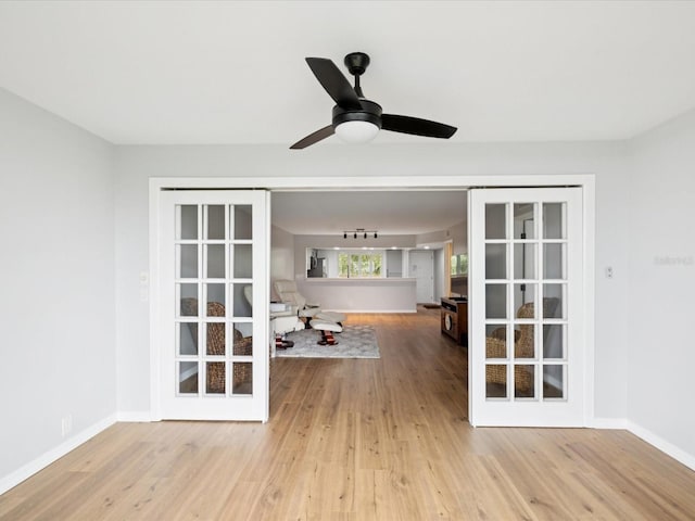 3062 Eastland Blvd Unit 405, Clearwater, FL 33761 - empty room featuring wood finished floors, baseboards, and ceiling fan