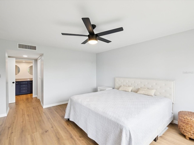 3062 Eastland Blvd Unit 405, Clearwater, FL 33761 - bedroom featuring light wood-style floors, baseboards, and a ceiling fan
