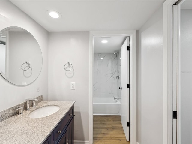 3062 Eastland Blvd Unit 405, Clearwater, FL 33761 - bathroom with vanity, wood finished floors, recessed lighting,  shower combination, and baseboards