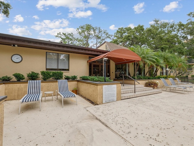 3062 Eastland Blvd Unit 405, Clearwater, FL 33761 - view of front of house featuring stucco siding and a patio area