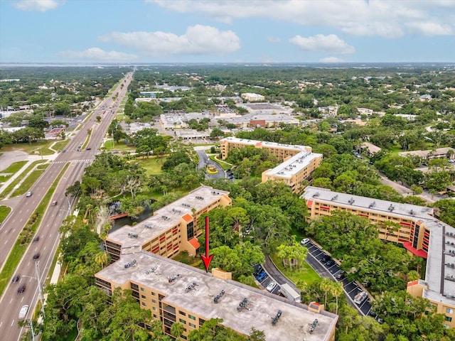 3062 Eastland Blvd Unit 405, Clearwater, FL 33761 - drone / aerial view of a highway and a tree filled landscape