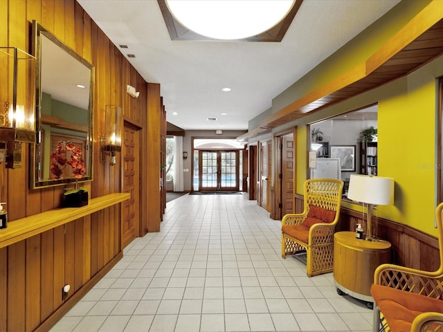 3062 Eastland Blvd Unit 405, Clearwater, FL 33761 - corridor featuring wood walls and light tile patterned flooring