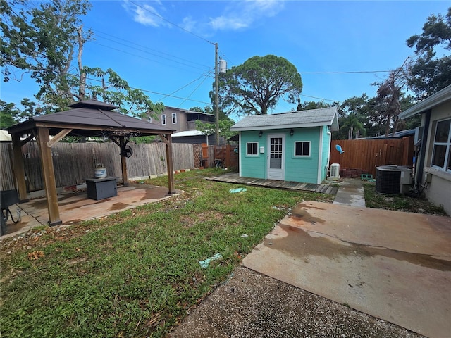7920 52nd St N, Pinellas Park, FL 33781 - view of yard featuring a patio area, cooling unit, a gazebo, and an outdoor structure
