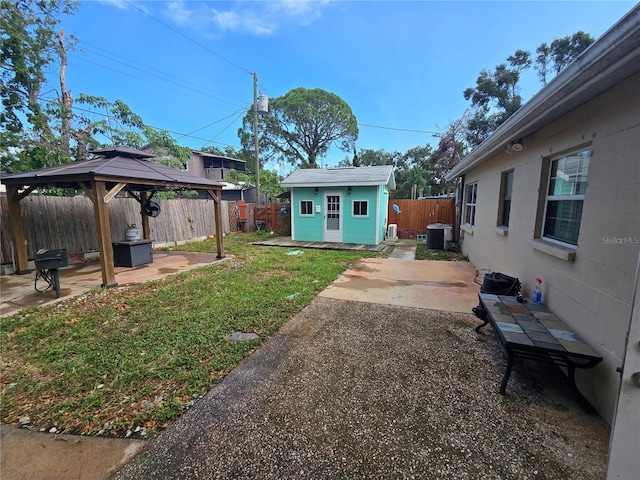 7920 52nd St N, Pinellas Park, FL 33781 - view of yard featuring a patio, a gazebo, an outbuilding, and cooling unit