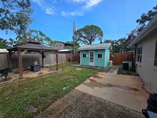 7920 52nd St N, Pinellas Park, FL 33781 - view of yard with a patio area, a gazebo, cooling unit, and an outdoor structure