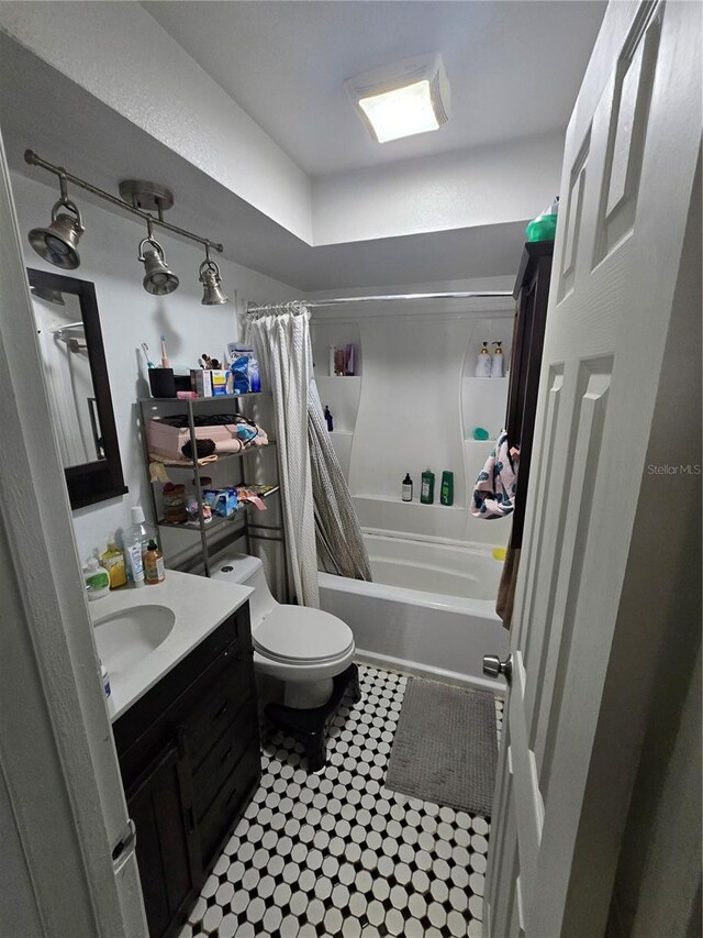 7920 52nd St N, Pinellas Park, FL 33781 - bathroom featuring vanity, shower / tub combo with curtain, and toilet