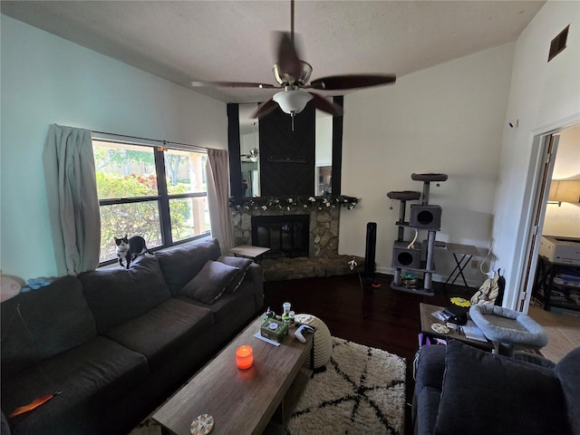 7920 52nd St N, Pinellas Park, FL 33781 - living room featuring a fireplace, a ceiling fan, and wood finished floors