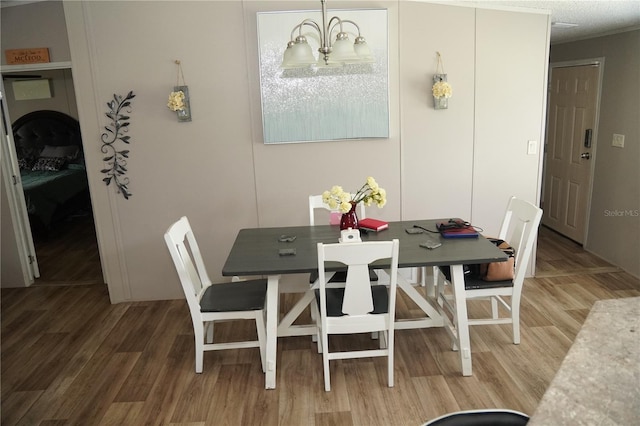 12008 Rose Ln, Riverview, FL 33569 - dining area with a chandelier and wood finished floors