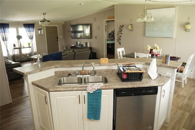 12008 Rose Ln, Riverview, FL 33569 - kitchen with dishwasher, a sink, an island with sink, open floor plan, and wood finished floors