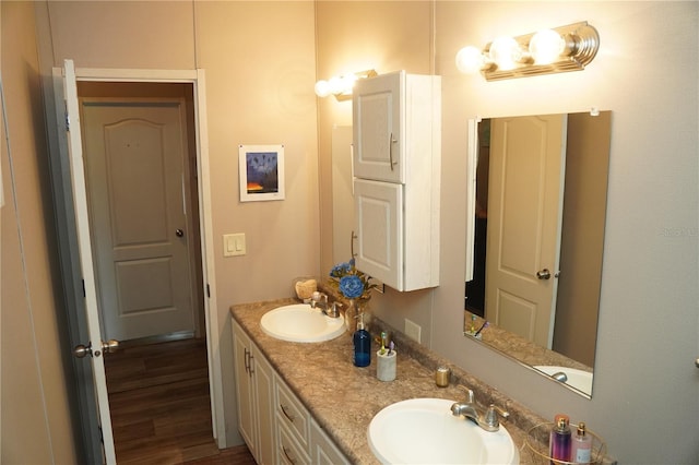 12008 Rose Ln, Riverview, FL 33569 - bathroom featuring double vanity and wood finished floors