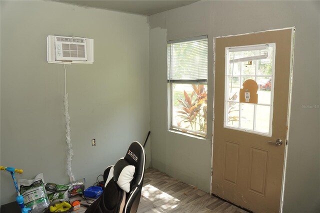 12008 Rose Ln, Riverview, FL 33569 - foyer with a wall mounted air conditioner and light wood-type flooring