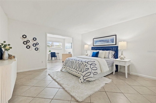 232 36th Ave N Unit 202C, Saint Petersburg, FL 33704 - bedroom featuring light tile patterned floors and baseboards