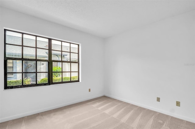 2749 Countryside Blvd Unit 20, Clearwater, FL 33761 - empty room with baseboards and light carpet