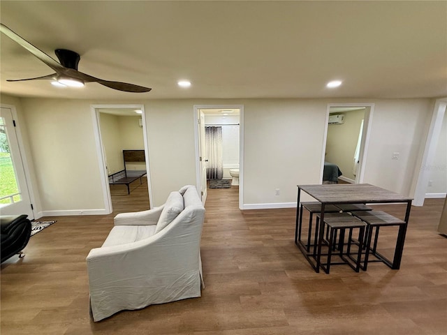 18452 Fort Dade Ave, Brooksville, FL 34601 - living area with recessed lighting, a wall mounted air conditioner, a ceiling fan, baseboards, and wood finished floors