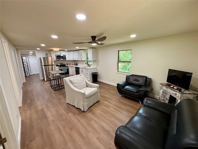 18452 Fort Dade Ave, Brooksville, FL 34601 - living area featuring baseboards, recessed lighting, wood finished floors, and a ceiling fan
