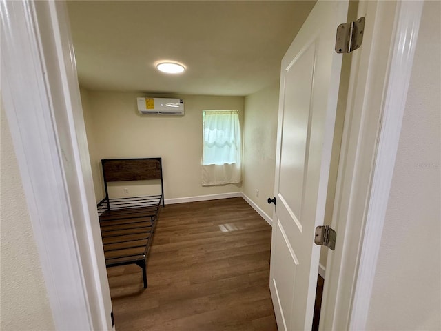 18452 Fort Dade Ave, Brooksville, FL 34601 - hall featuring an AC wall unit, dark wood finished floors, and baseboards