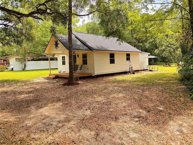 18452 Fort Dade Ave, Brooksville, FL 34601 - back of property featuring a shingled roof