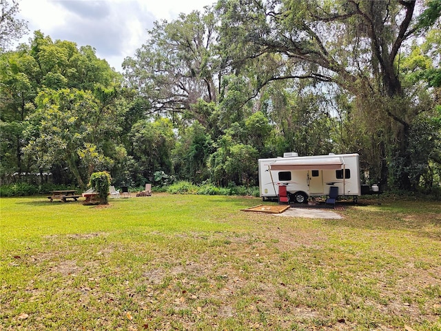 18452 Fort Dade Ave, Brooksville, FL 34601 - view of green lawn featuring an attached carport
