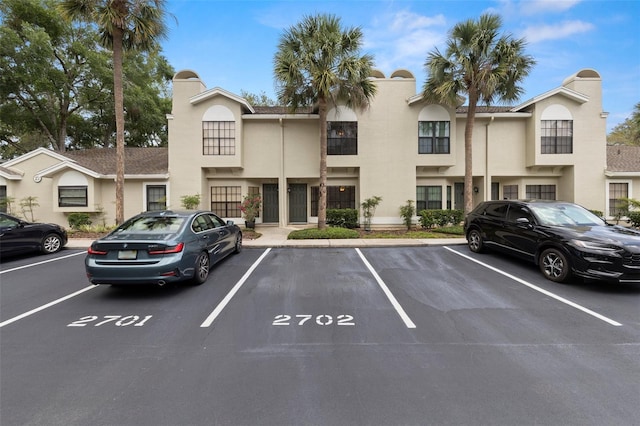 5100 Burchette Rd Unit 2702, Tampa, FL 33647 - view of front of house featuring uncovered parking and stucco siding