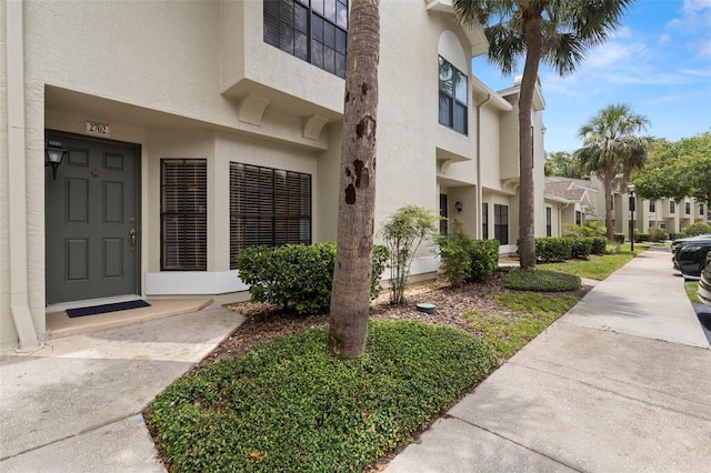 5100 Burchette Rd Unit 2702, Tampa, FL 33647 - view of exterior entry featuring stucco siding